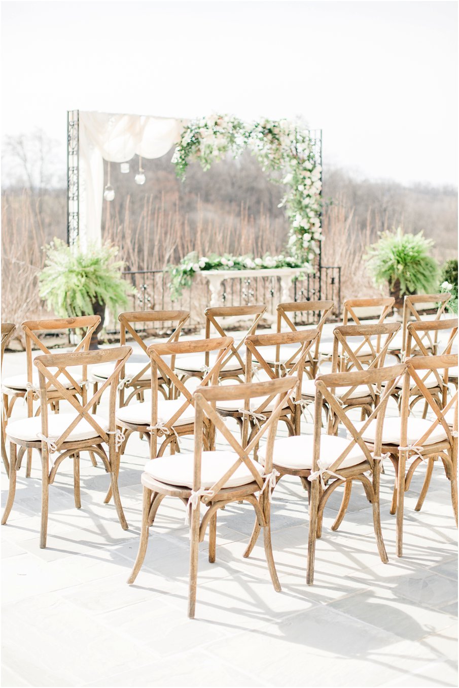 outdoor-wedding-ceremony-romantic-arbor-wooden-cross-back-chairs.jpg