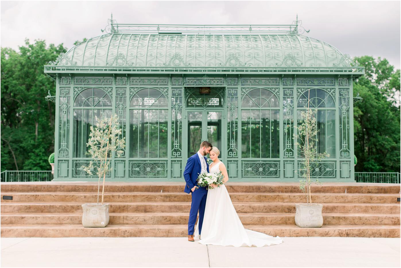 Bride and Groom in front of the atrium at Morais Vineyard