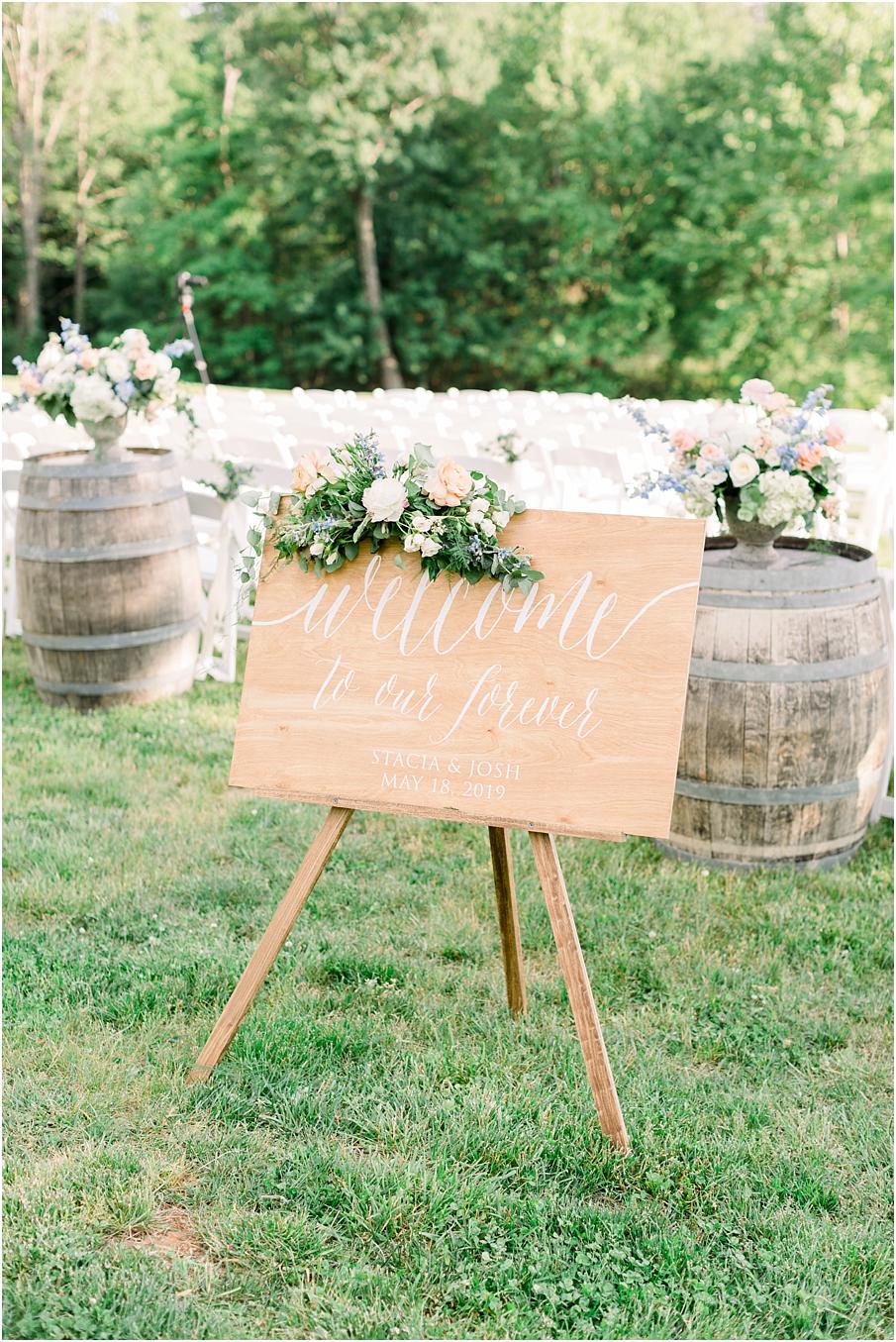 Wooden, calligraphed welcome sign for Veritas Winery ceremony