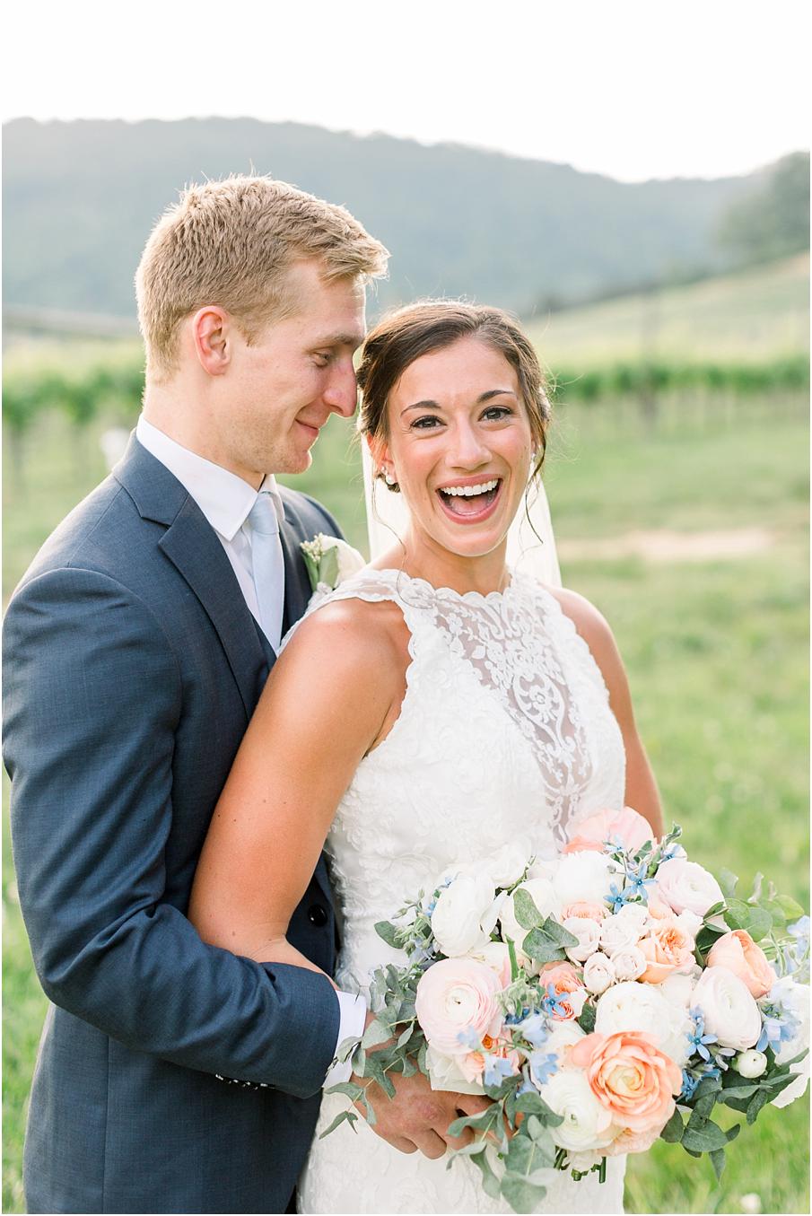 A joyful bride and groom laughing and being silly after their Veritas winery wedding