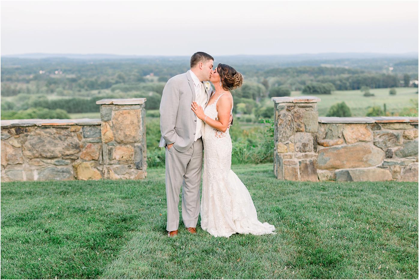 Bride and groom portrait in front of stunning views of Bluemont, Virginia at Bluemont Vineyards wedding venue