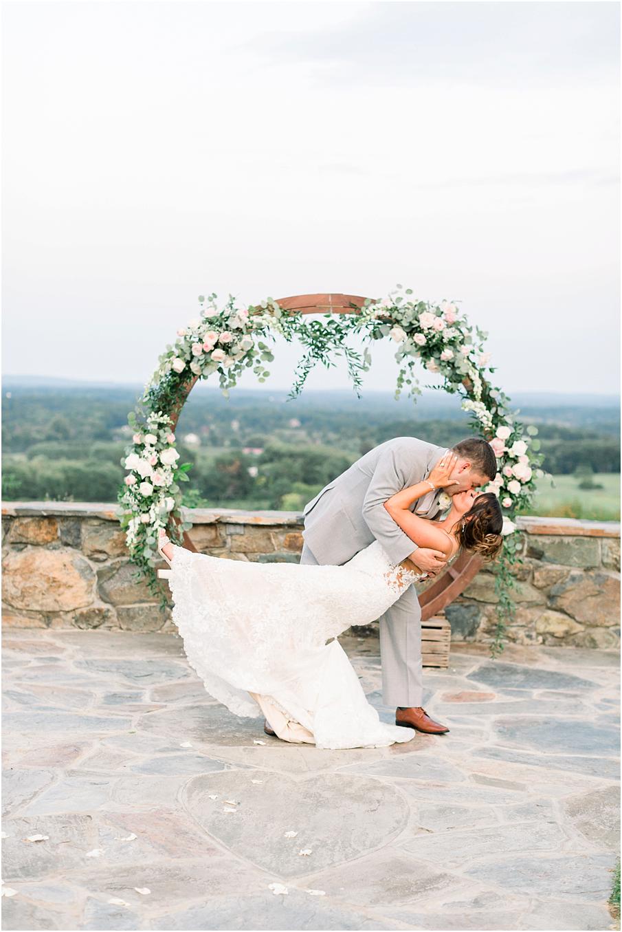 Circle arch with greenery and florals at Bluemont Vineyard