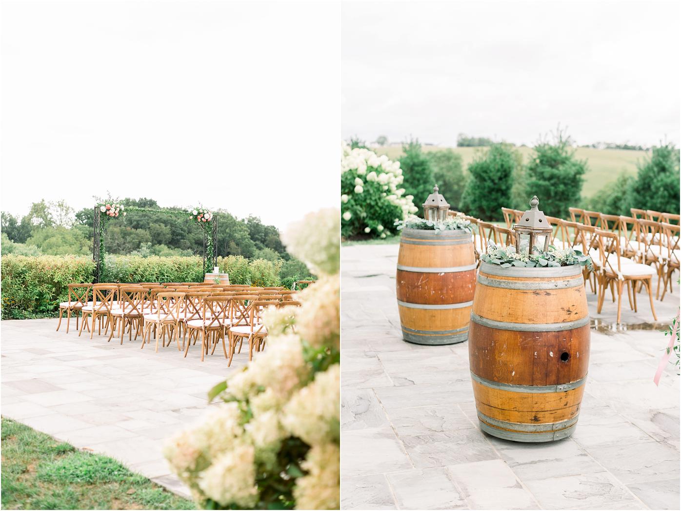 Shadow creek ceremony site with brown cross back chairs and wine barrels