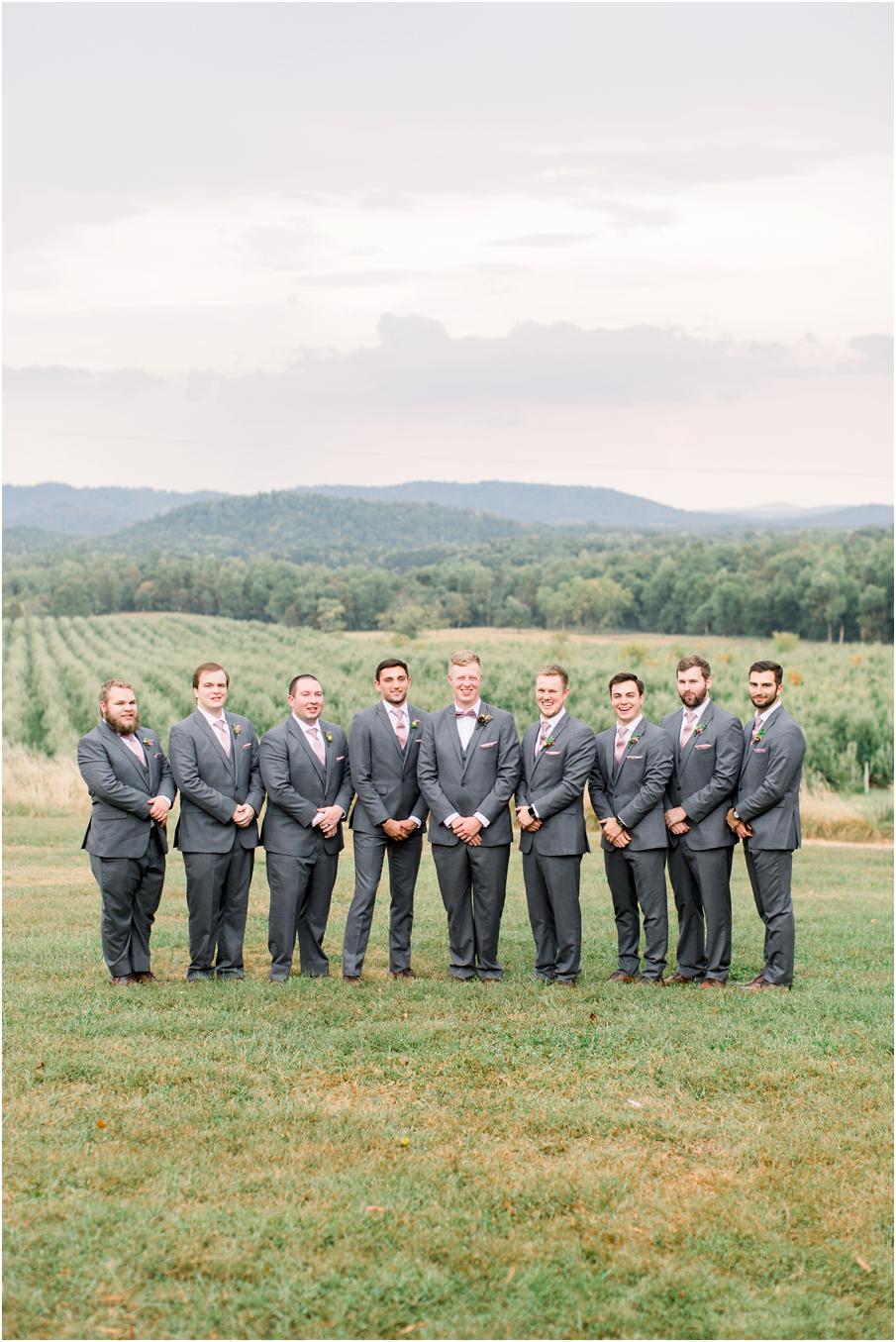 Groom and groomsmen portrait with mountains and vineyards in the background